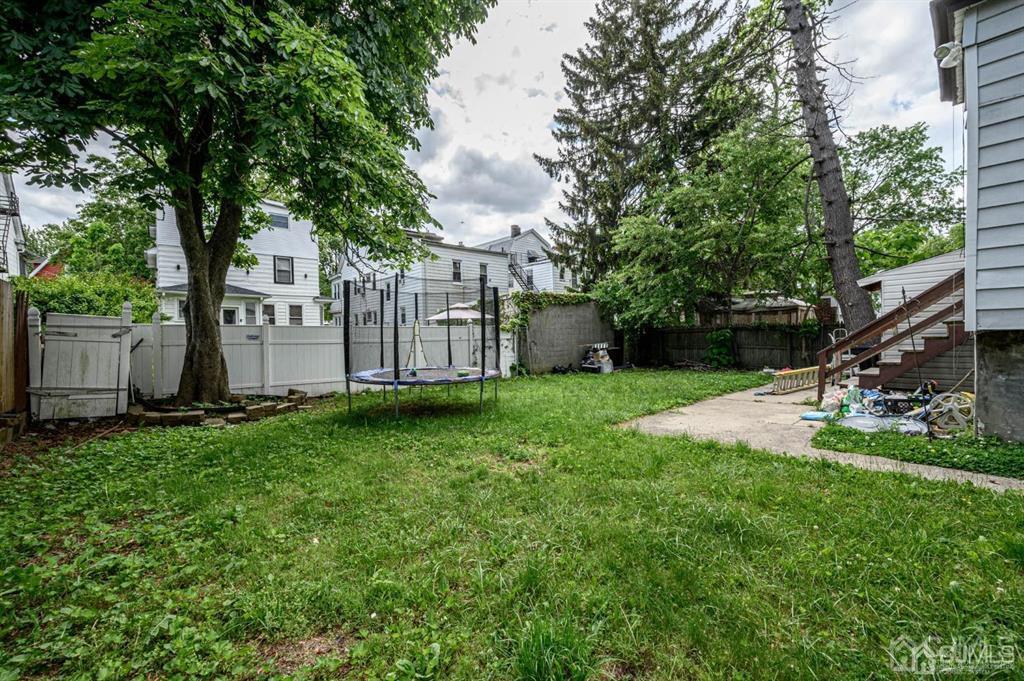8 Ricord Street Newark, NJ 07106 - Photo 36 of 39 a view of a backyard with large trees