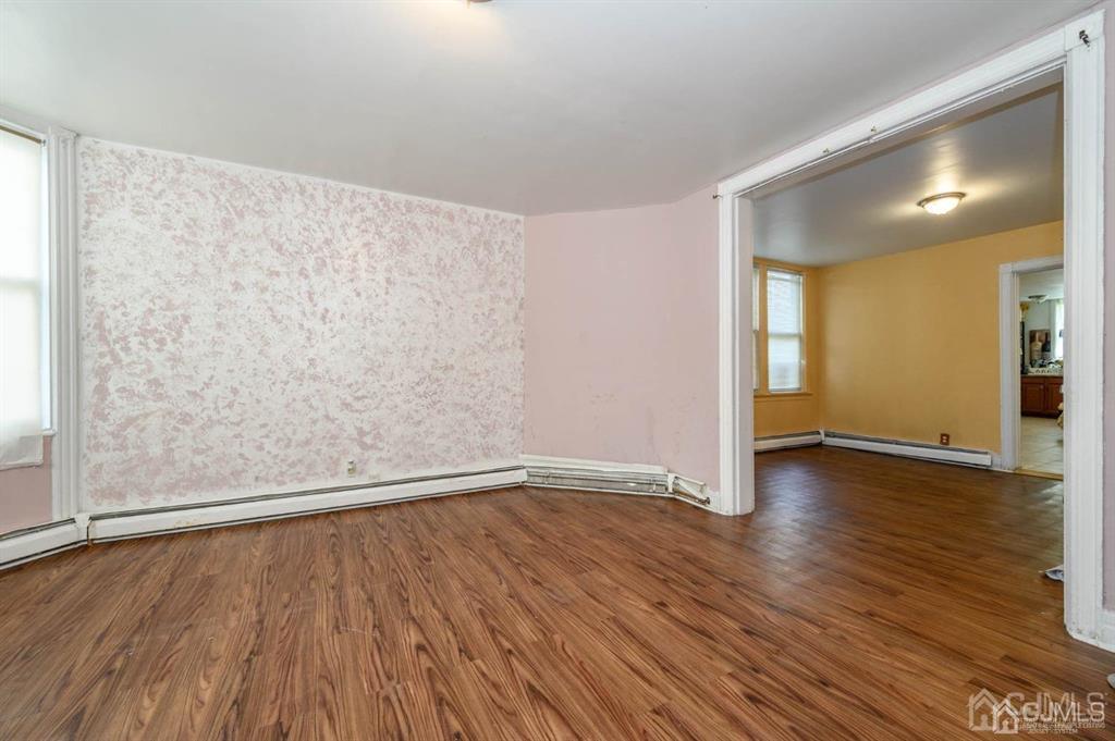 8 Ricord Street Newark, NJ 07106 - Photo 6 of 39 a view of an empty room with wooden floor