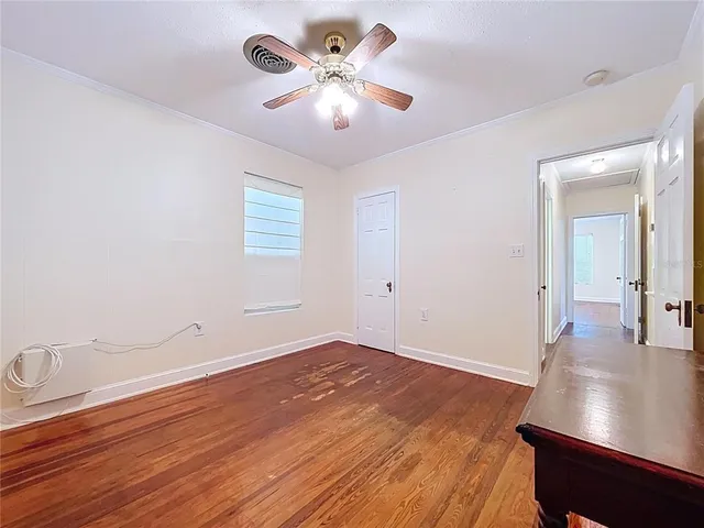 an empty room with a view of a livingroom