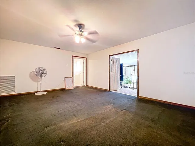 a view of the room with furniture and a garage