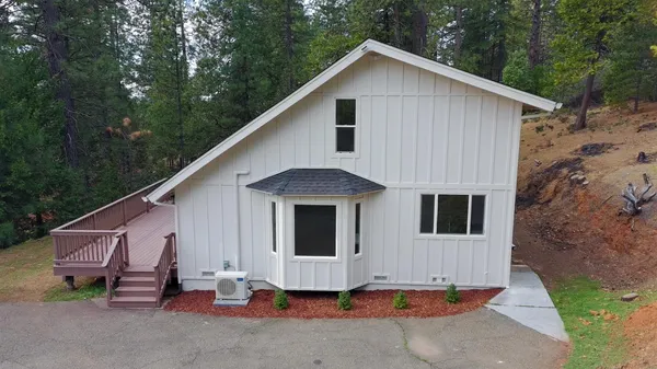 a front view of a house with a garage
