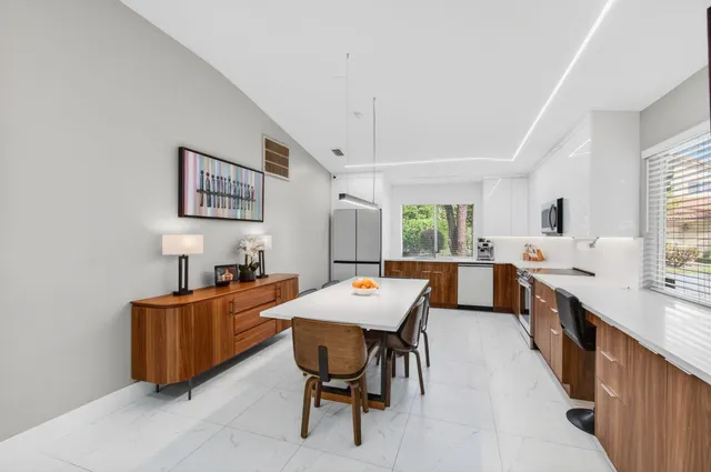 a kitchen with stainless steel appliances a stove sink and microwave