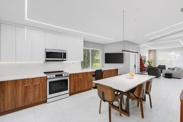 a view of a livingroom with furniture and a flat screen tv