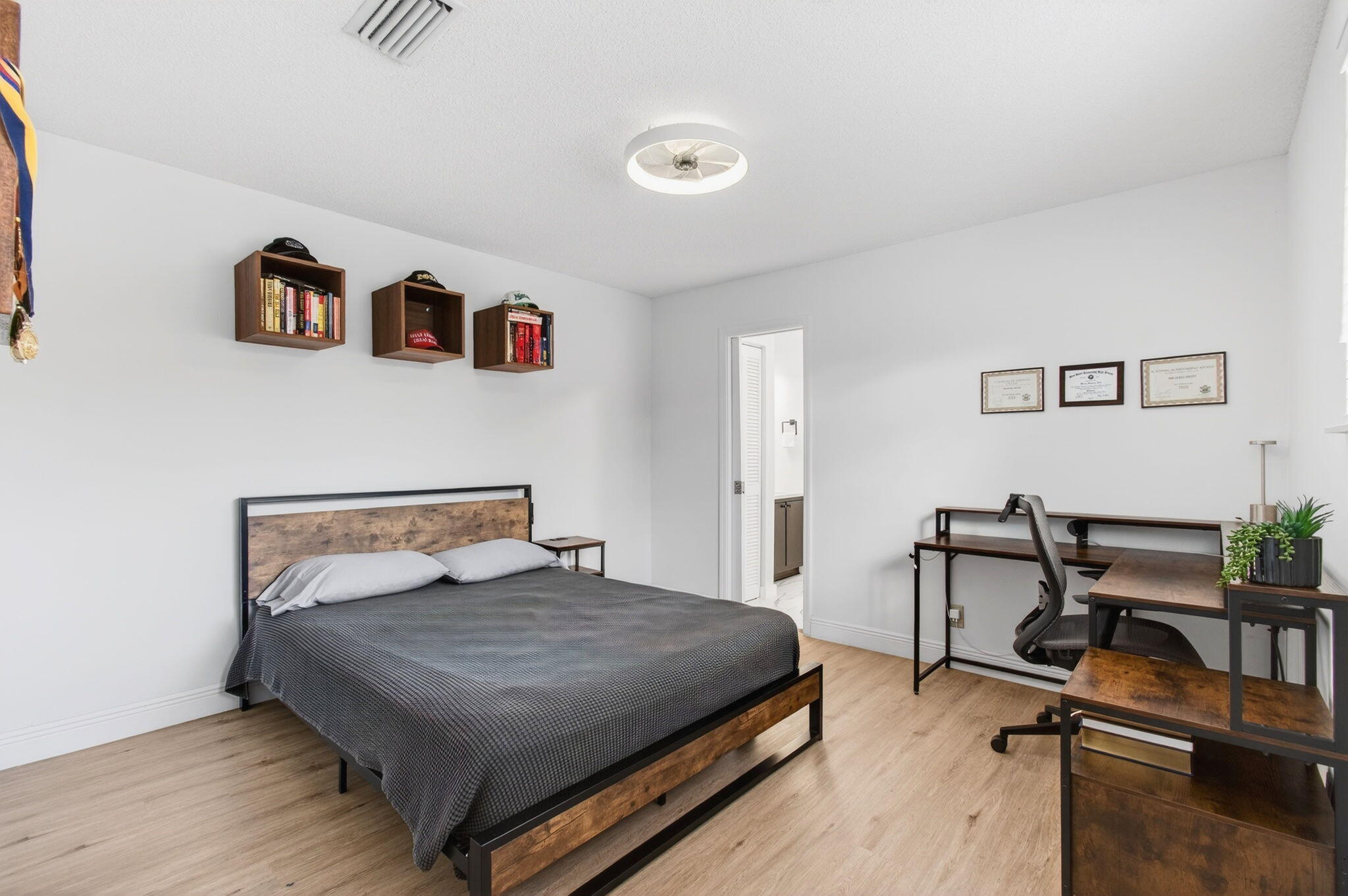 6766 Via Regina Boca Raton, FL 33433 - Photo 22 of 57 a bedroom with a bed and a desk in it