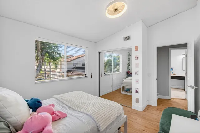 a bedroom with a bed and window