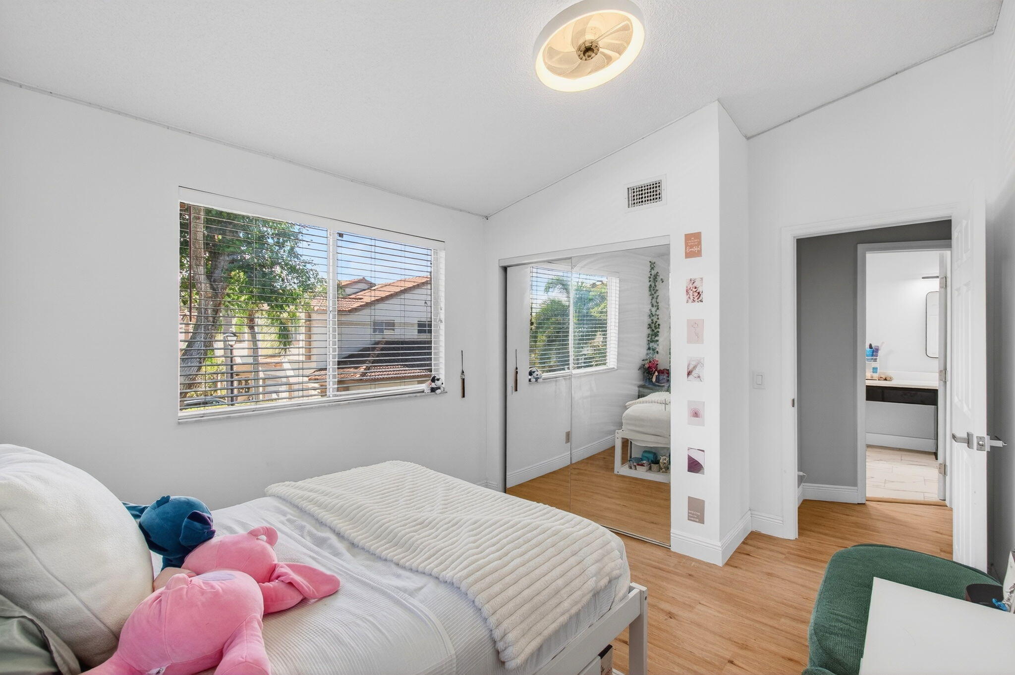 6766 Via Regina Boca Raton, FL 33433 - Photo 33 of 57 a bedroom with a bed and wooden floor