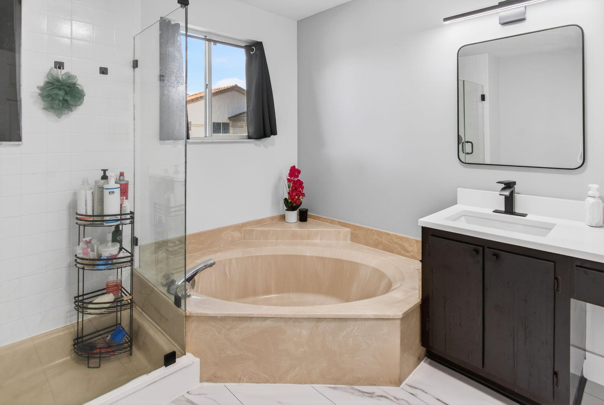 6766 Via Regina Boca Raton, FL 33433 - Photo 35 of 57 a bathroom with a bathtub sink and mirror