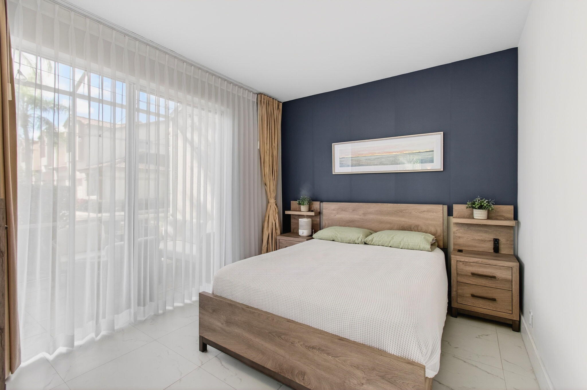 6766 Via Regina Boca Raton, FL 33433 - Photo 38 of 57 a bedroom with a bed and dresser