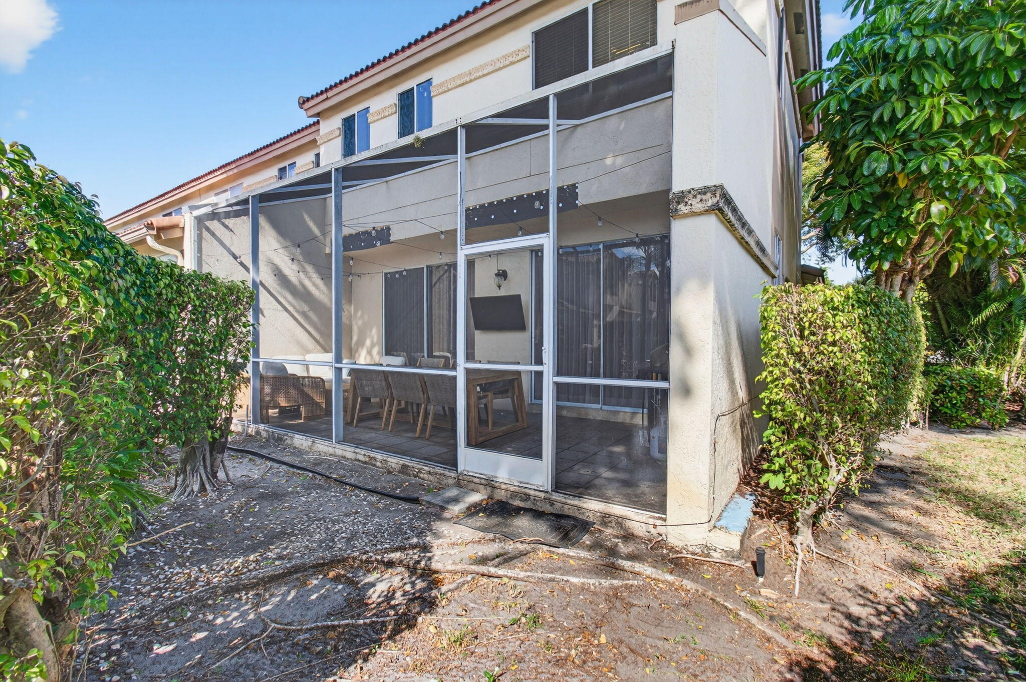 6766 Via Regina Boca Raton, FL 33433 - Photo 48 of 57 a view of a house with a yard and plants
