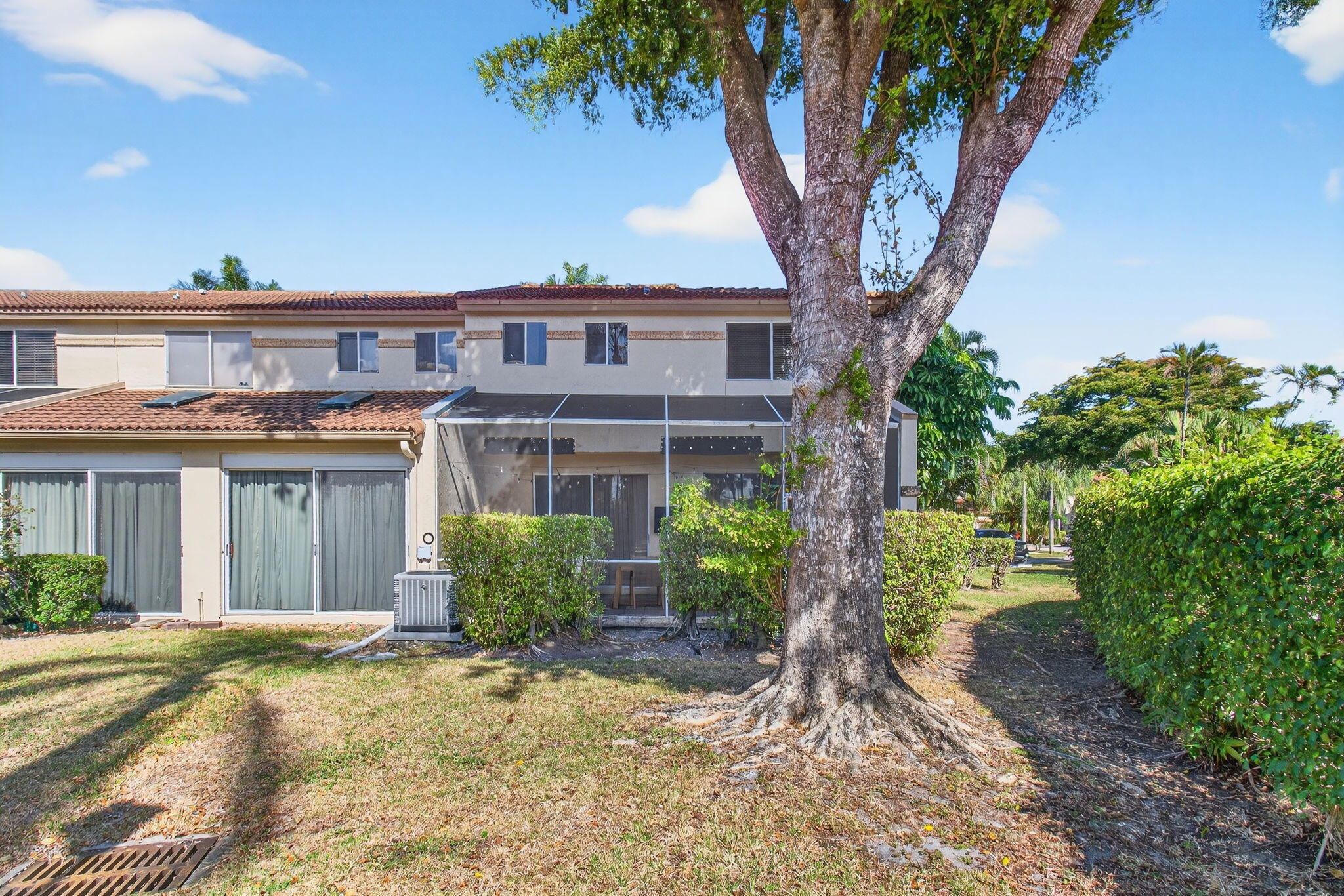 6766 Via Regina Boca Raton, FL 33433 - Photo 49 of 57 a front view of a house with garden