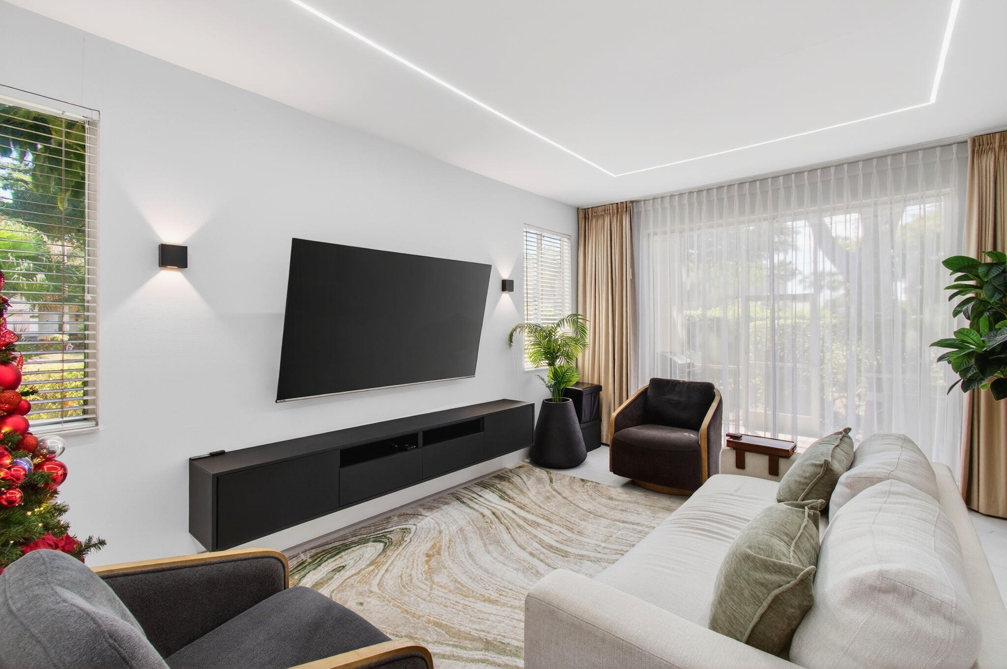 6766 Via Regina Boca Raton, FL 33433 - Photo 6 of 57 a living room with furniture and a flat screen tv