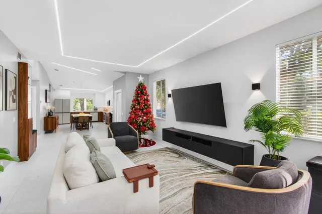 a view of living room filled with furniture and white walls