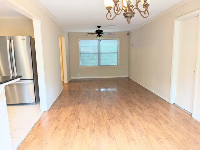 a view of empty room with a fireplace