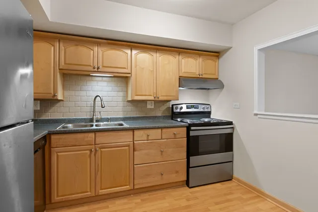 a view of an empty room and closet area