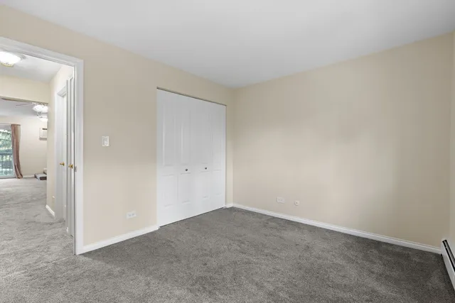 a bathroom with a granite countertop toilet a sink and a bathtub