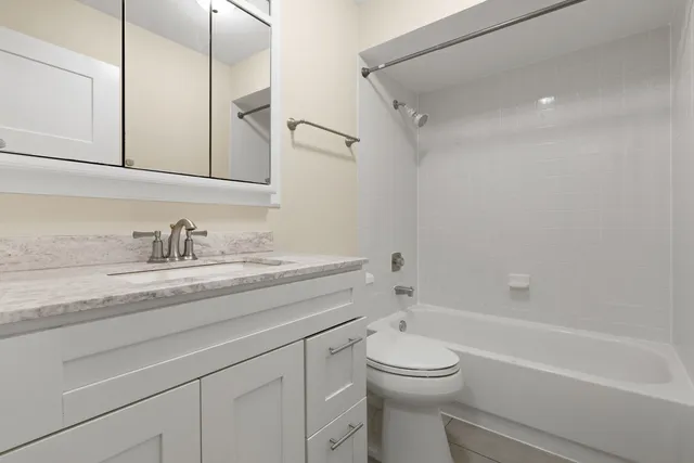 an entryway and livingroom with furniture