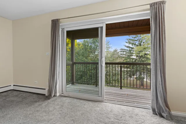 a view of a balcony with wooden floor