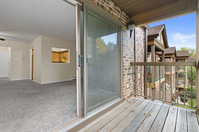 a view of a balcony with wooden floor