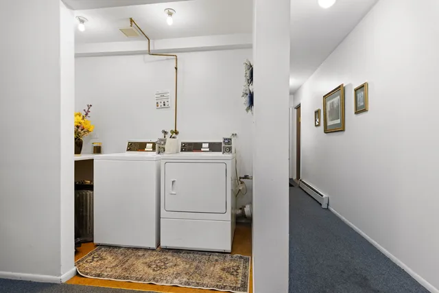 a front view of a building with a garden