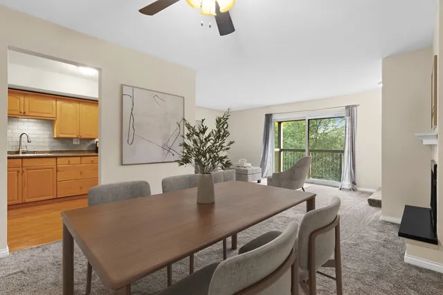 a dining room with furniture and window