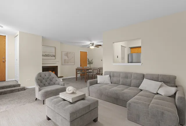 a view of an empty room with a fireplace