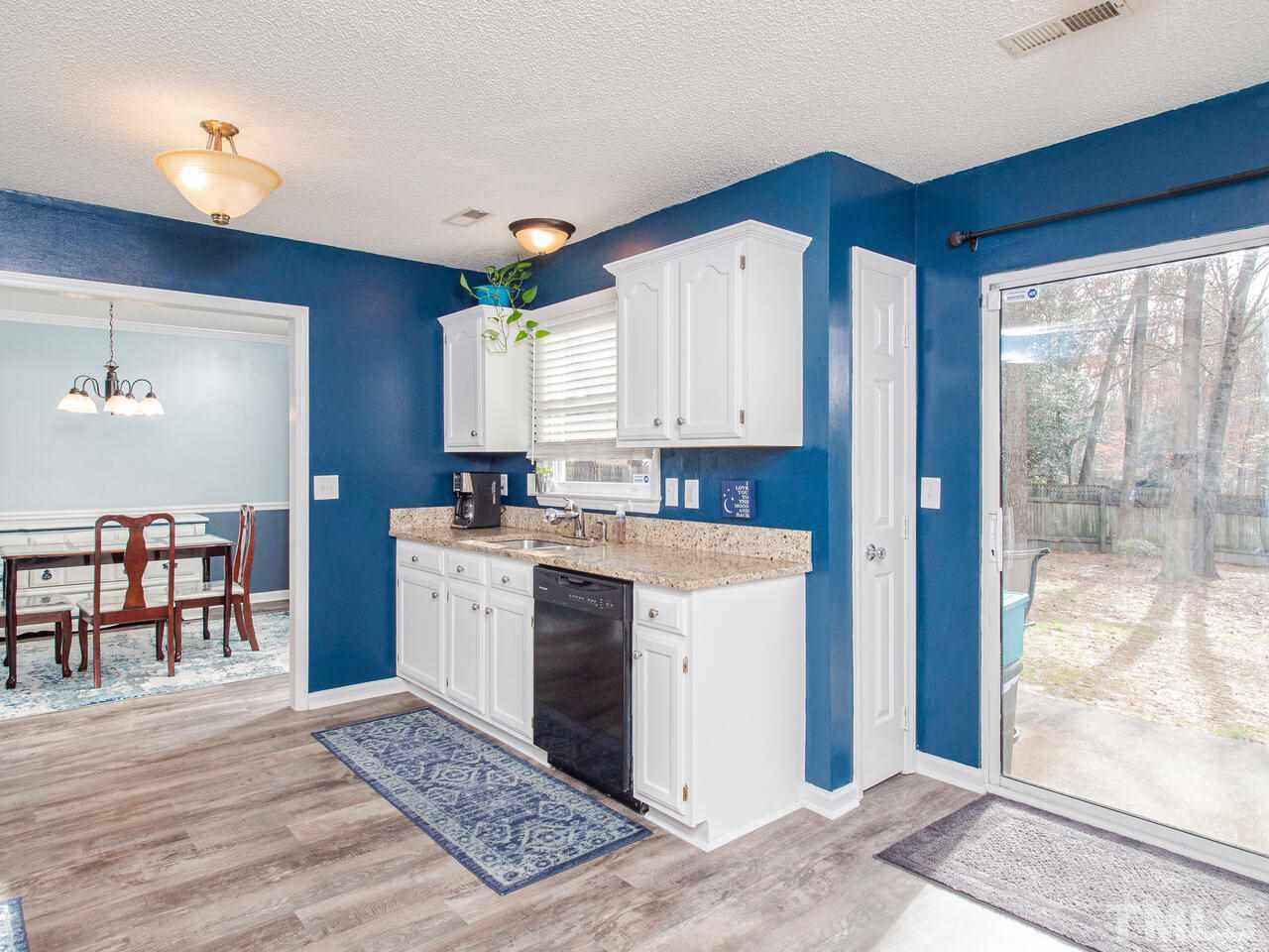 3540 Tunas Street Raleigh, NC 27616 - Photo 7 of 24 a kitchen with a sink cabinets and window