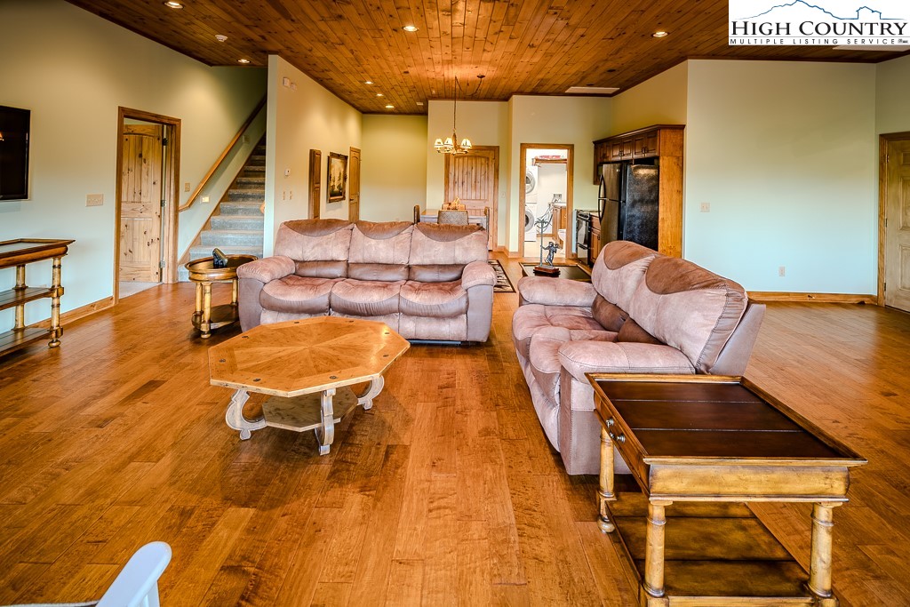 196 Hanley Lane Boone, NC 28607 - Photo 18 of 27 a living room with furniture and a wooden floor