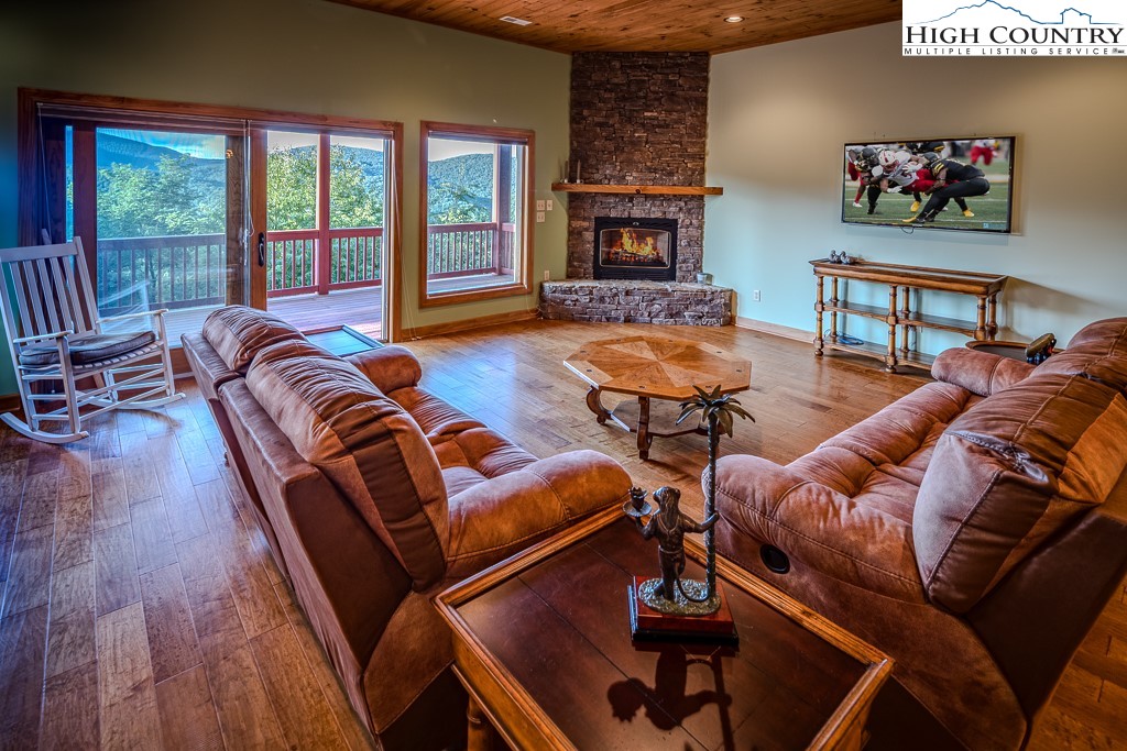 196 Hanley Lane Boone, NC 28607 - Photo 19 of 27 a living room with furniture and a fireplace