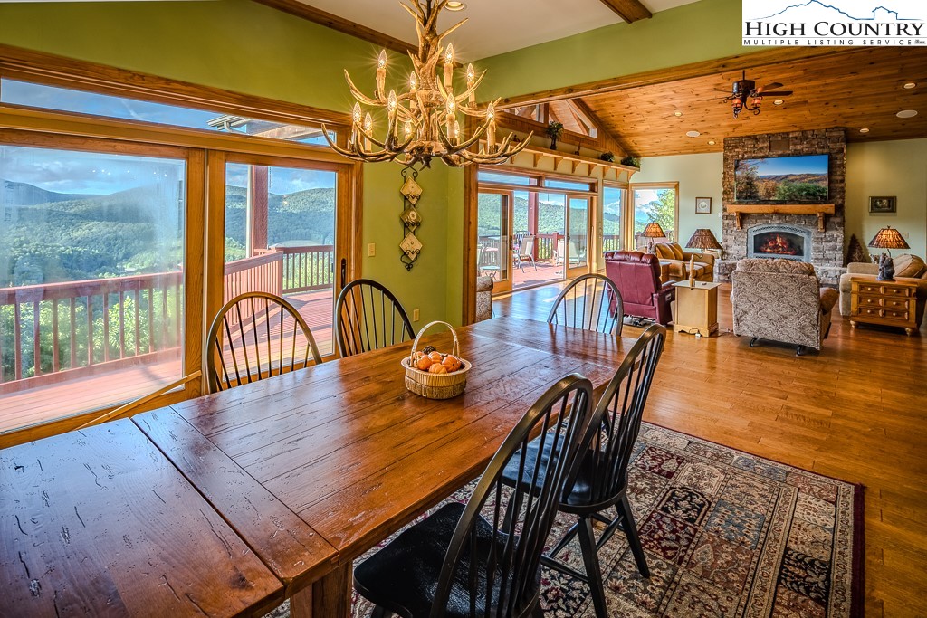 196 Hanley Lane Boone, NC 28607 - Photo 7 of 27 a view of a dining room with furniture window and wooden floor
