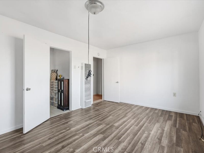 19876 Lodema Road Apple Valley, CA 92307 - Photo 18 of 40 a view of empty room with wooden floor