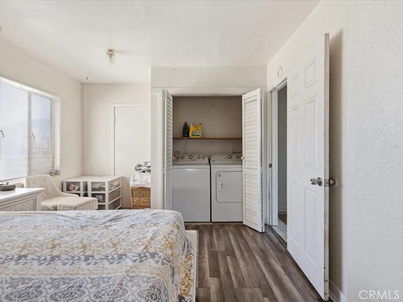 19876 Lodema Road Apple Valley, CA 92307 - Photo 19 of 40 a bedroom with a bed and wooden floor