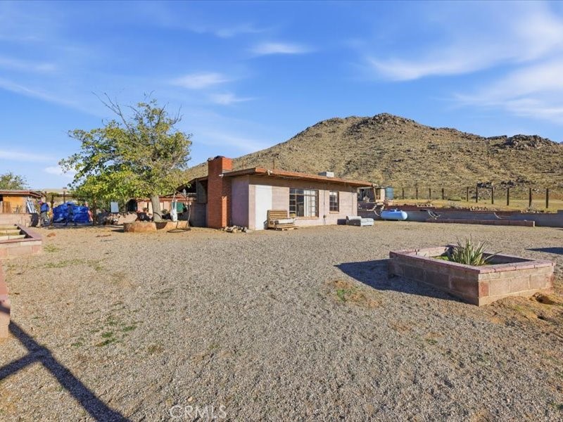 19876 Lodema Road Apple Valley, CA 92307 - Photo 34 of 40 a front view of a house with a yard