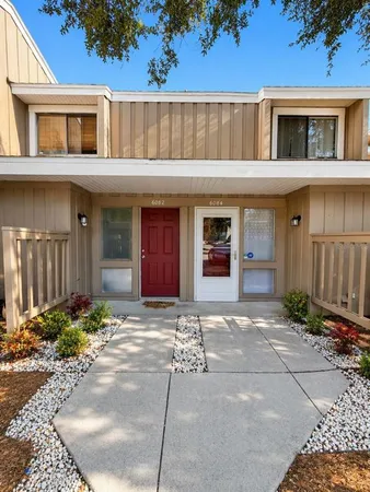 a front view of a house with yard