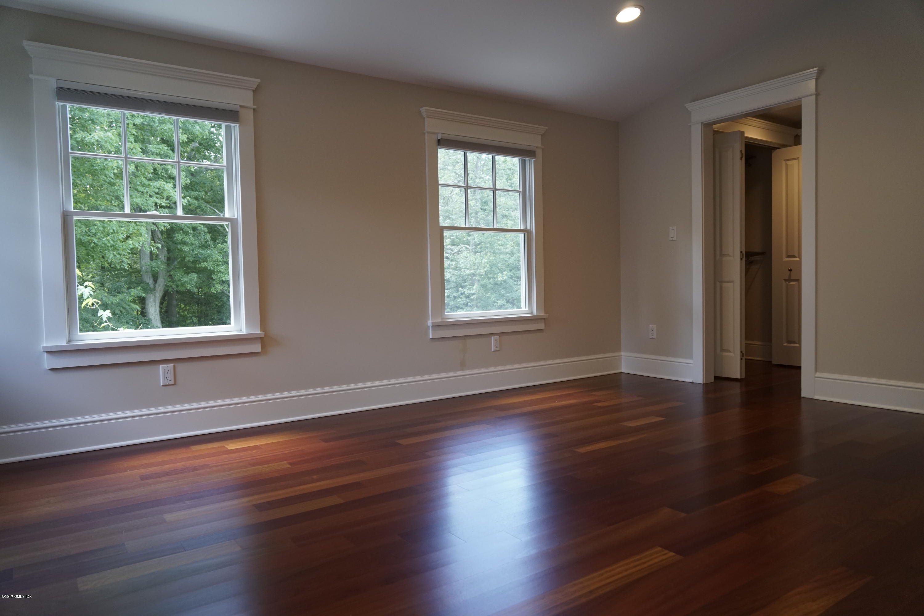 12 Birdsong Place Riverside, CT 06878 - Photo 11 of 30 a view of an empty room with wooden floor and a window