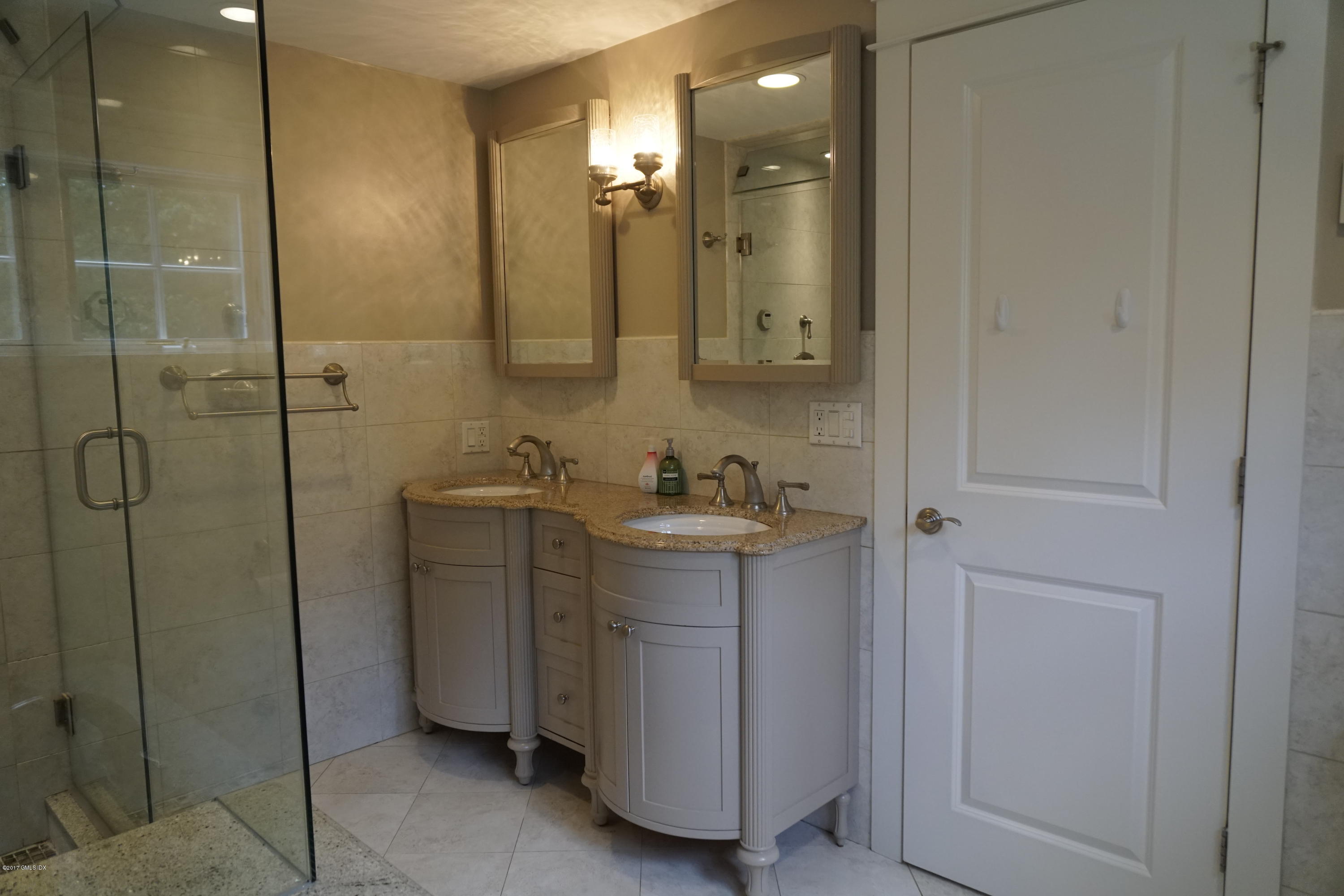 12 Birdsong Place Riverside, CT 06878 - Photo 14 of 30 a bathroom with a shower sink and mirror