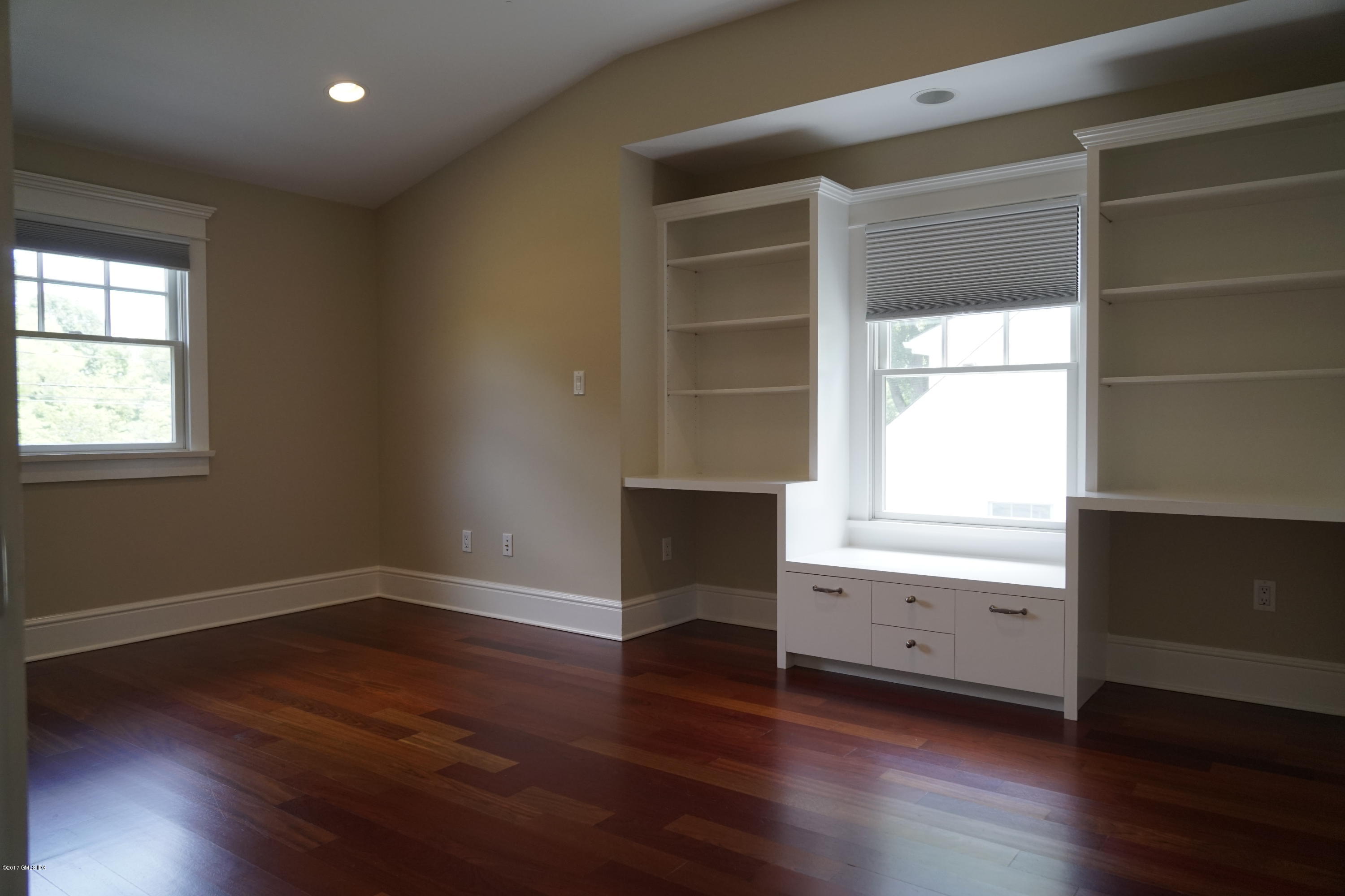 12 Birdsong Place Riverside, CT 06878 - Photo 19 of 30 an empty room with wooden floor and cabinet