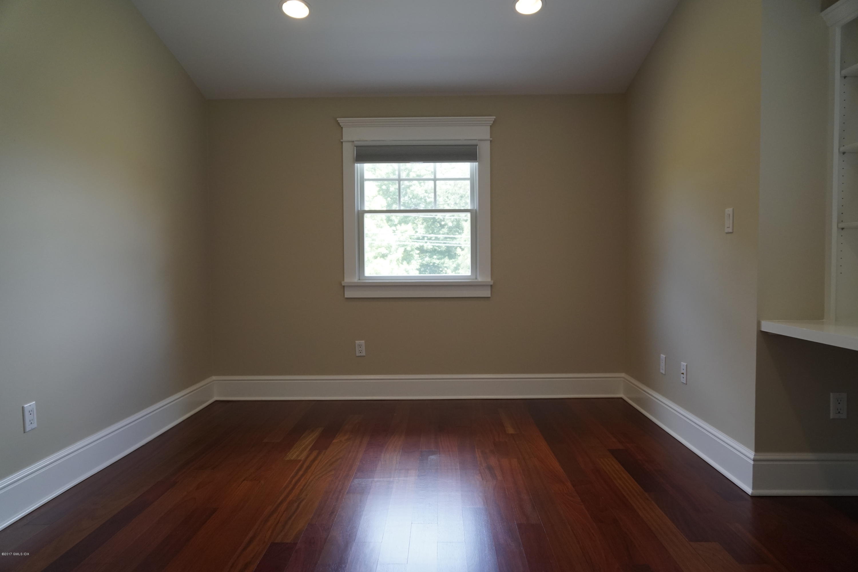 12 Birdsong Place Riverside, CT 06878 - Photo 21 of 30 wooden floor and window in an empty room