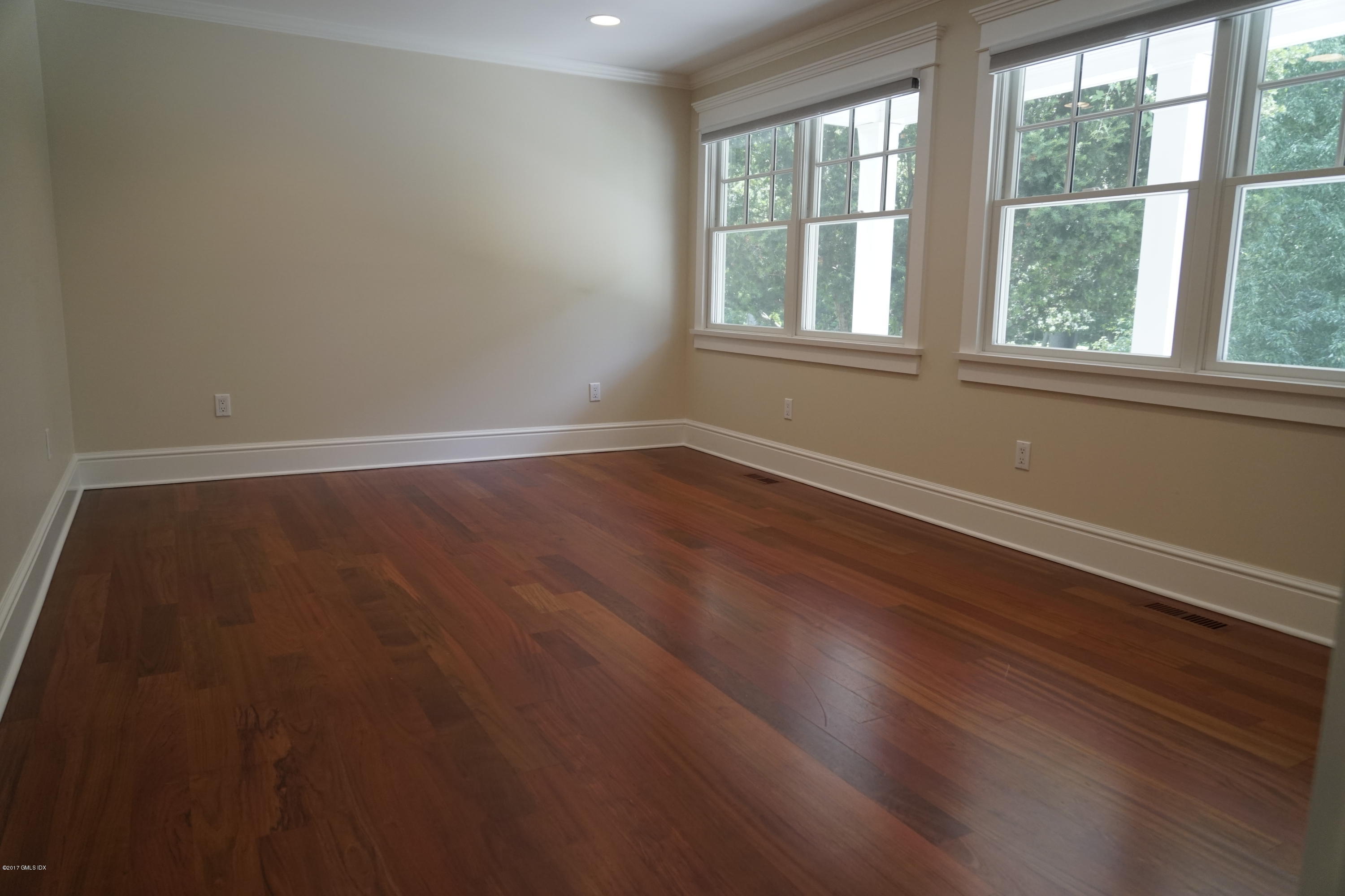 12 Birdsong Place Riverside, CT 06878 - Photo 23 of 30 an empty room with wooden floor and windows