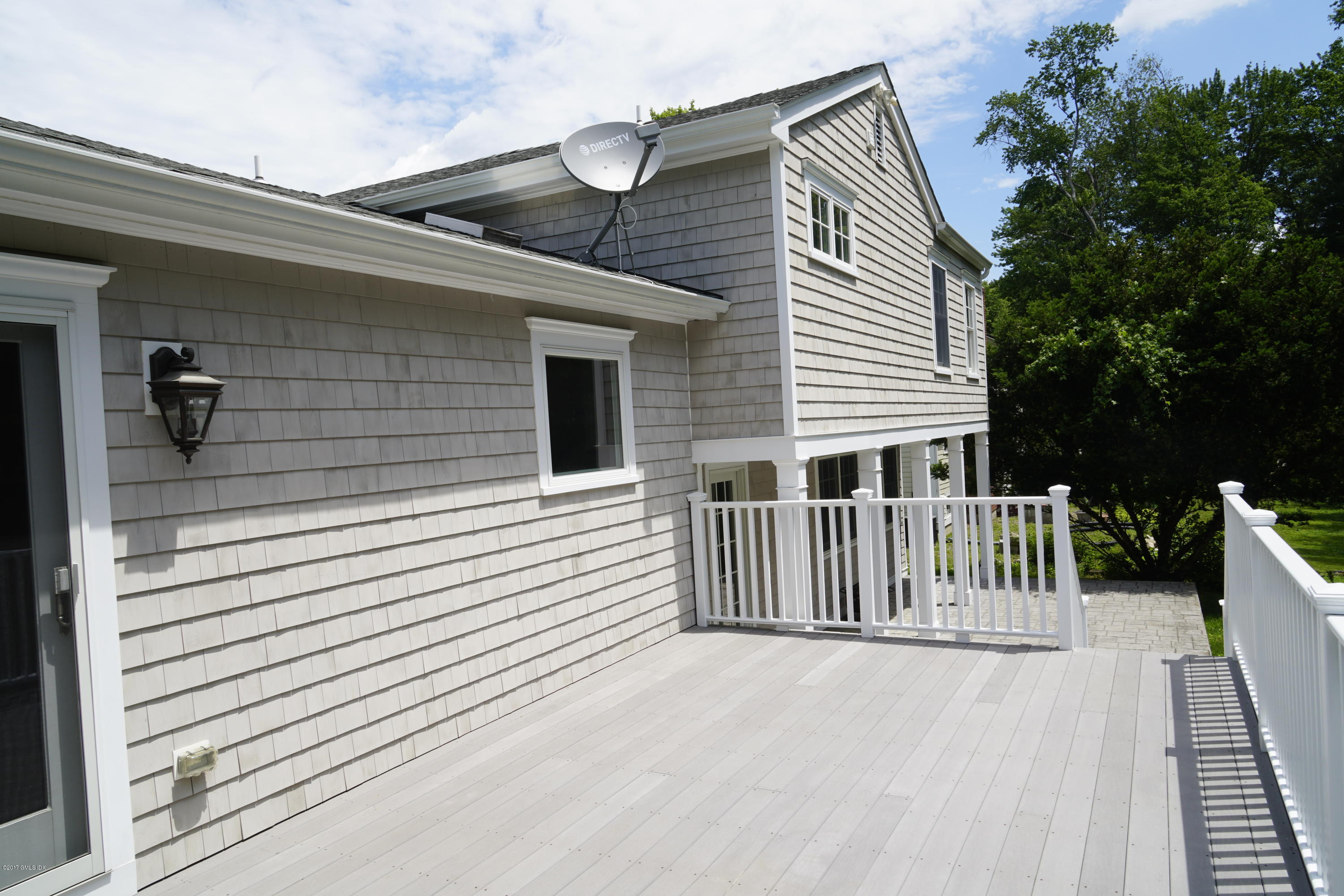 12 Birdsong Place Riverside, CT 06878 - Photo 28 of 30 a view of a house with a deck