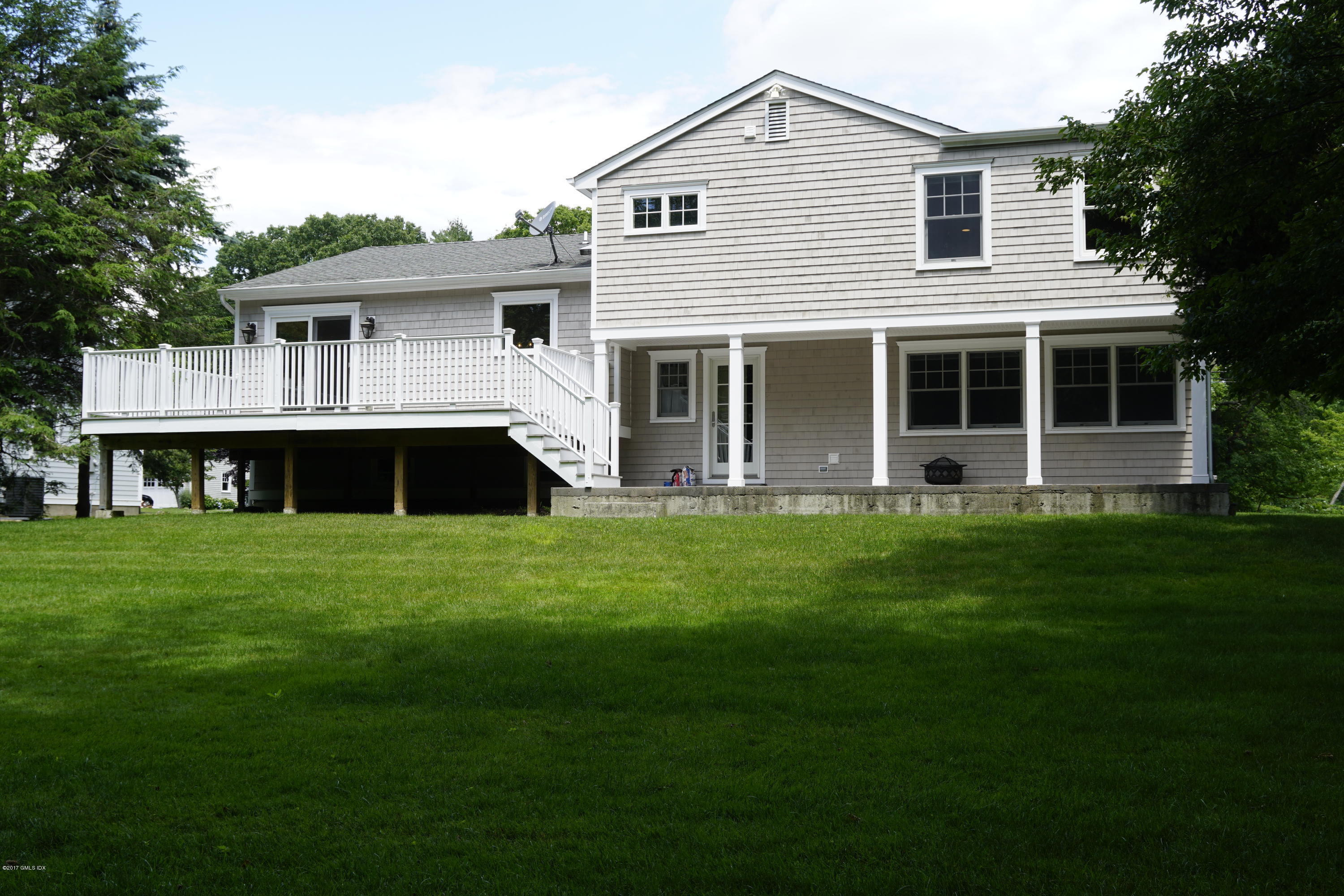 12 Birdsong Place Riverside, CT 06878 - Photo 30 of 30 a front view of a house with a garden and porch