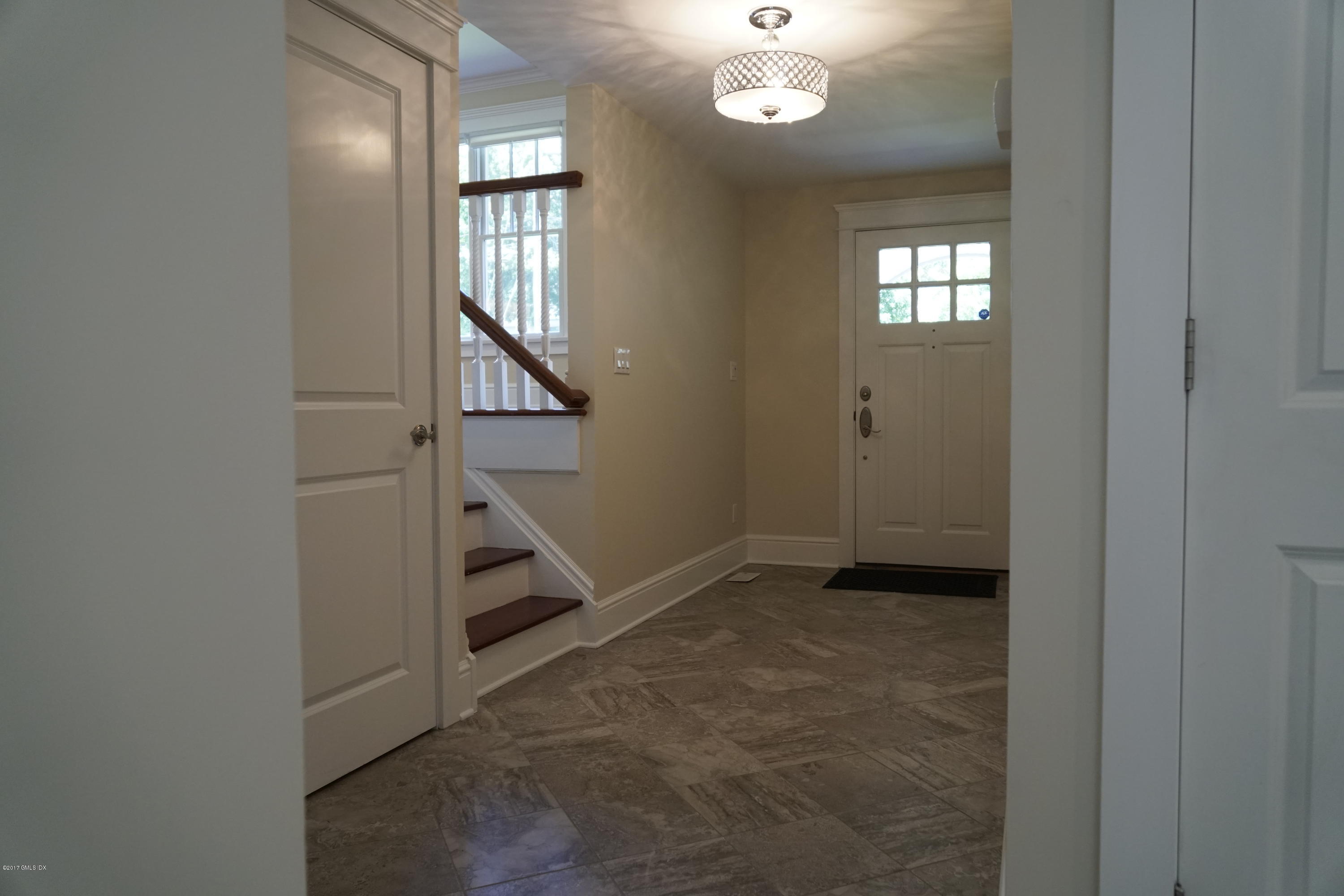 12 Birdsong Place Riverside, CT 06878 - Photo 3 of 30 wooden floor in an empty room with a window and stairs