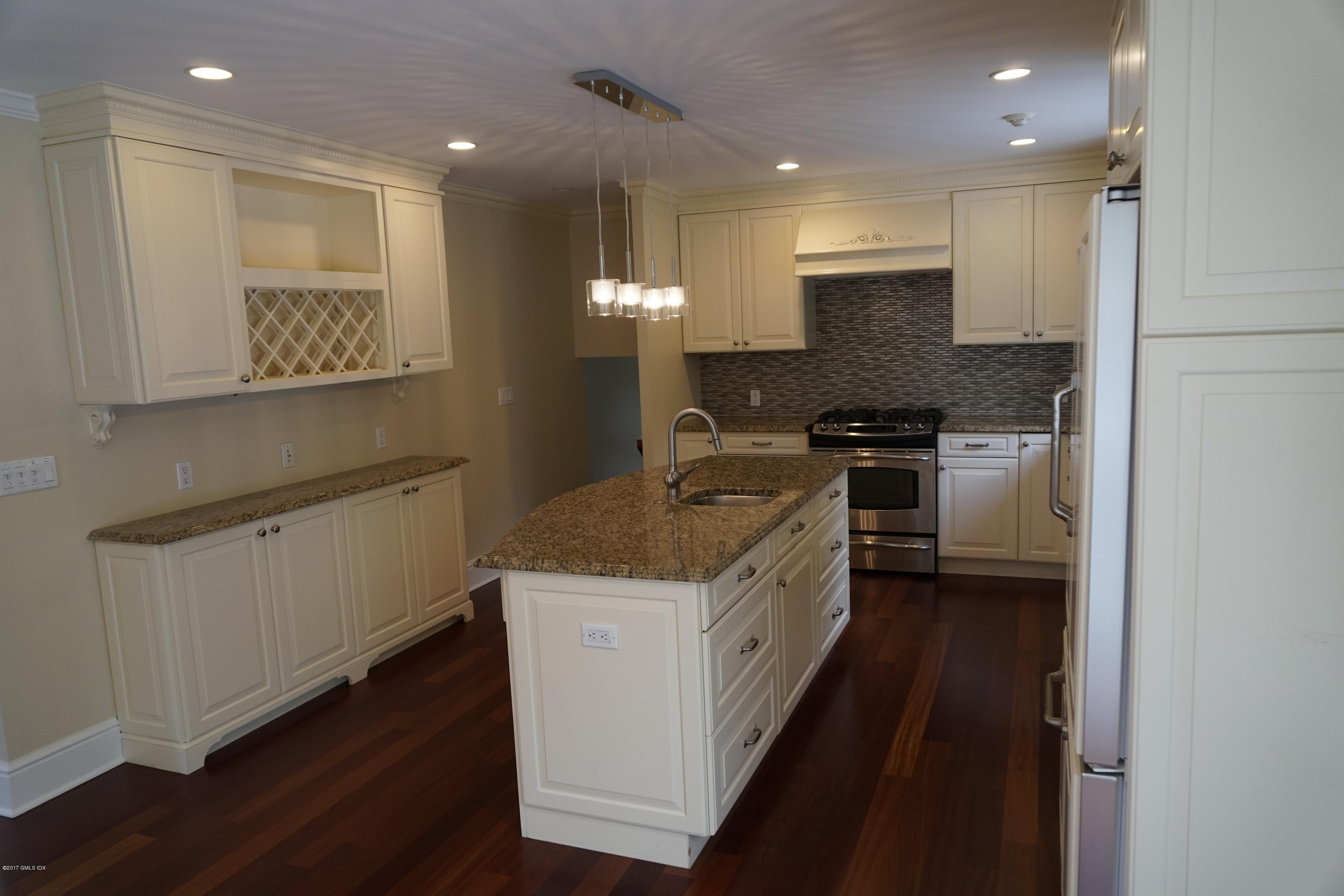 12 Birdsong Place Riverside, CT 06878 - Photo 7 of 30 a kitchen with stainless steel appliances granite countertop a stove a sink and a refrigerator