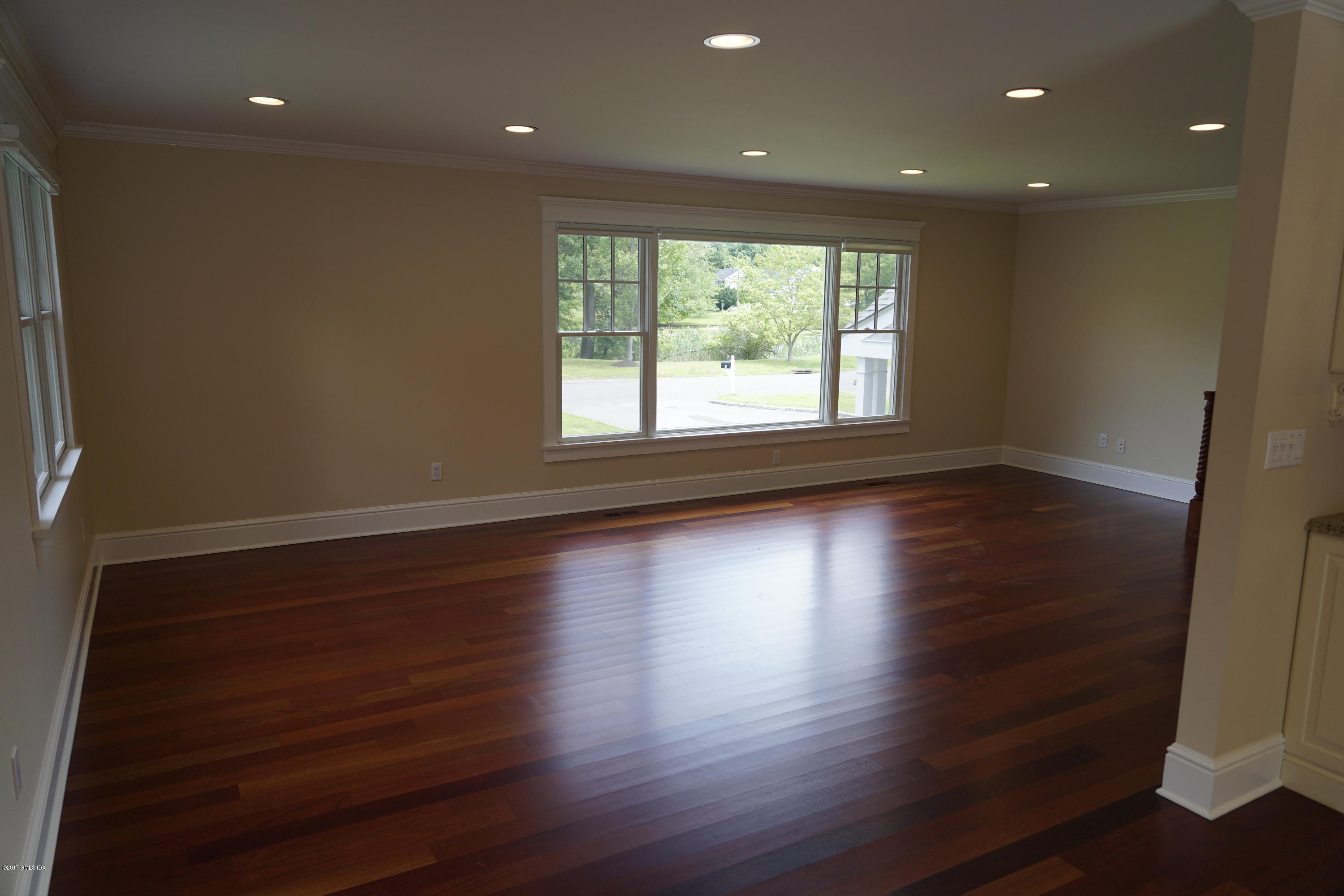 12 Birdsong Place Riverside, CT 06878 - Photo 10 of 30 an empty room with wooden floor and windows