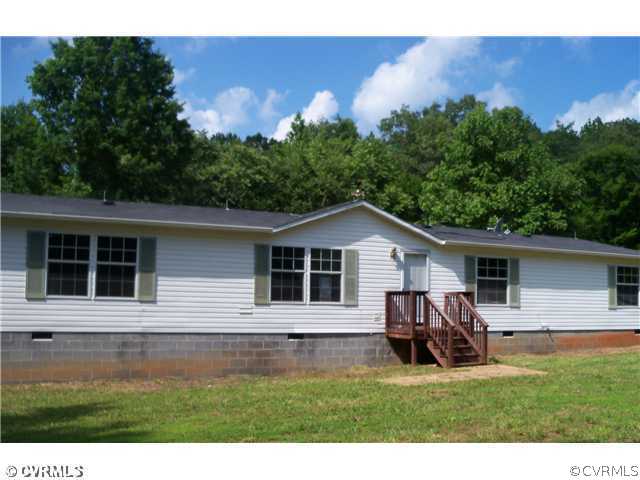 3737 Cedar Lane Road Kents Store, VA 23084 - Photo 1 of 10 a view of a house with a patio