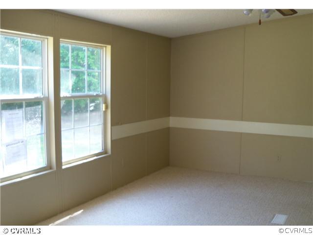 3737 Cedar Lane Road Kents Store, VA 23084 - Photo 3 of 10 a view of an empty room with a window