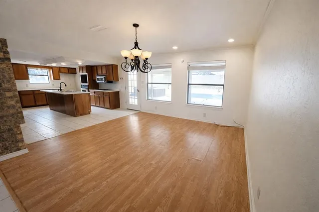 a view of a kitchen with microwave and a dishwasher