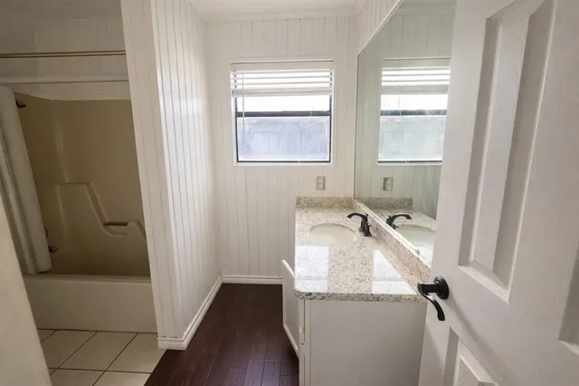 a room with washing machine and window