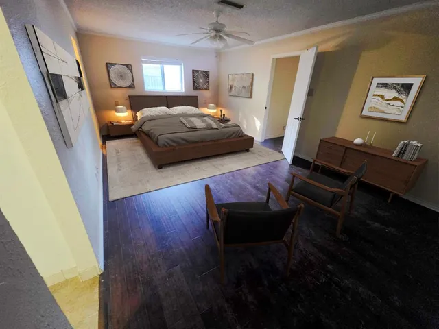 a bedroom with furniture and a window