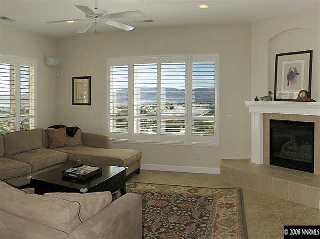 6808 Marble Canyon Road Reno, NV 89511 - Photo 3 of 9 a living room with furniture and a fireplace