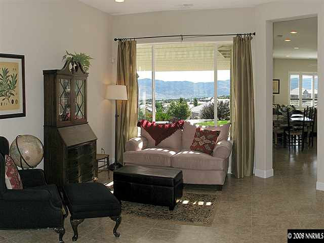 6808 Marble Canyon Road Reno, NV 89511 - Photo 5 of 9 a living room with furniture and a fireplace